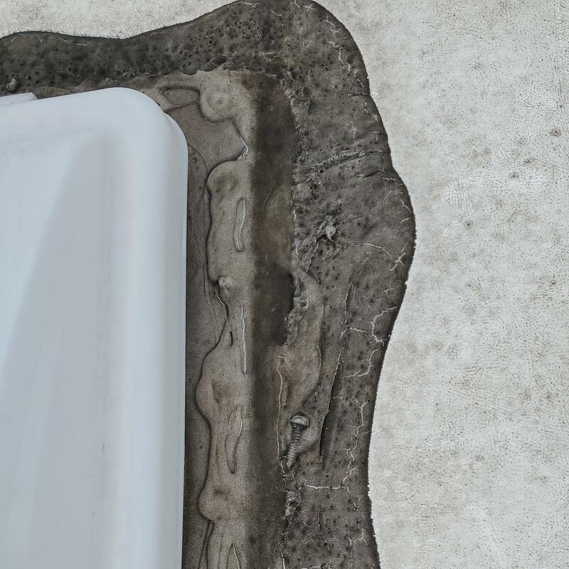 Damaged roofing sealant with imbedded screws from somewhere? It is possible that water intrusion may occur. Could be a costly repair!